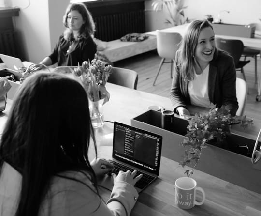 women having a business meeting on a table